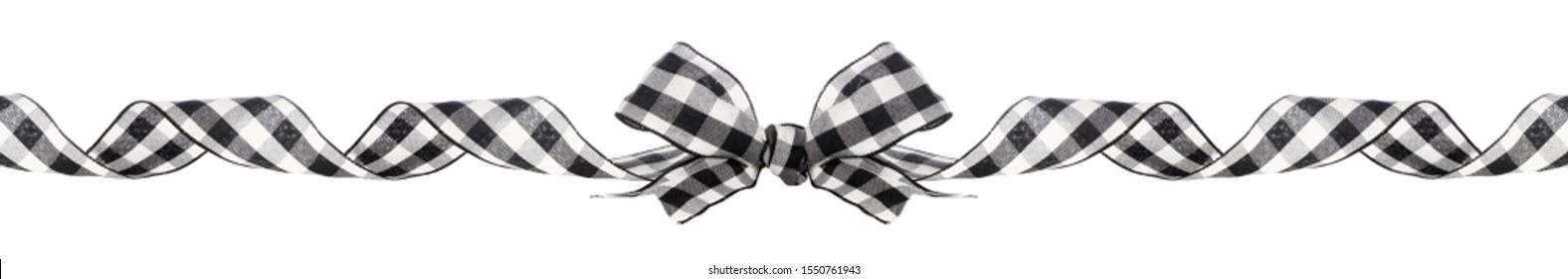 Long Christmas Border Of Black And White Buffalo Plaid Bow And Ribbon Isolated On A White Background