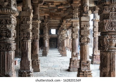long column ruins of qutub minar complex. Columns surround the minaret. Taken in New Delhi, India