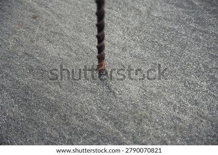 Long Core Drill Drilling into Concrete Tile, Construction Work Close-Up, Industrial Tool Action Concept