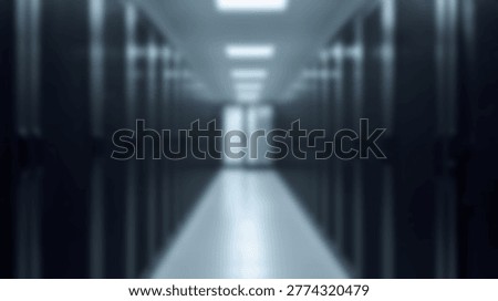 A long corridor in a data center server room with rows of server racks and equipment. The image shows the infrastructure and technology of a modern data center.