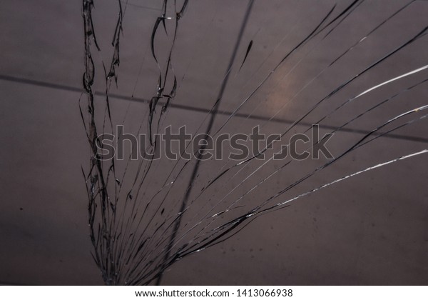 long cracks on broken glass close up. texture,\
background, wallpaper.