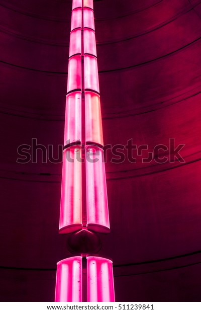 long crimson road as vertical long lamp against\
dark background, vertical lamps divided into sections with lights\
against dark background, high quality resolution, ceiling office\
lamp with light