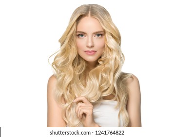 Long curly blonde hair woman with healthy skin and natural makeup isolated on white