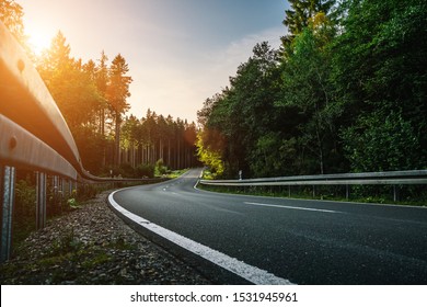 Long Curvy Forest Road In Alpine Mountains 