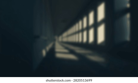 A long, dark corridor with a repeating pattern of windows casting light and shadows.