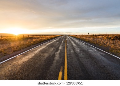 Long Desert Highway At The Sunset