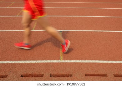 Long distance runners are running on the track