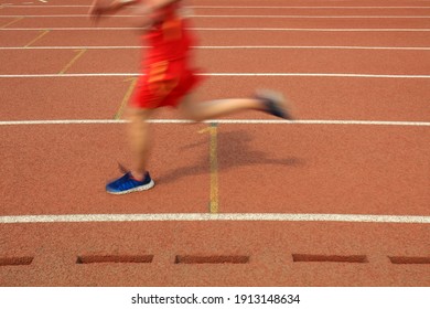 Long distance runners are running on the track