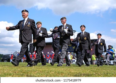 Long Eaton, Derbyshire, UK 06/21/2015 Veteran Soldiers Marching In A Parade             