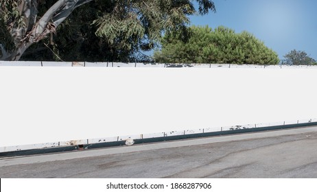 Long empty white hoarding with mock up place at city street. Industrial concept. - Shutterstock ID 1868287906