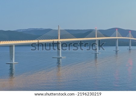 Long exposure aerial of the Peljesac bridge at dusk, which connects the mainland with the peninsula, near Ston in Croatia