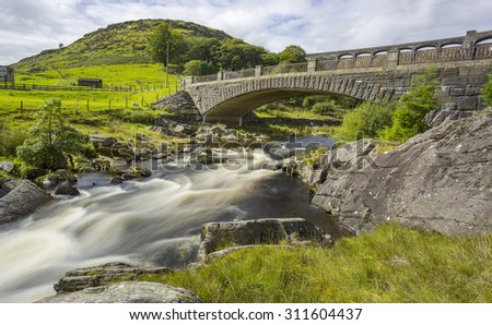 Long exposure of bridge with Claerwen Dam behind, Elan Valley, Wales, UK