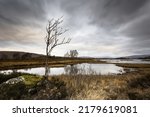 Long exposure capturing the moving clouds above a wintery Rannoch Moor in the Scottish Highlands 