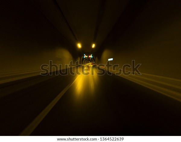 Long exposure from a car in Tunnel.\
Transportation background.