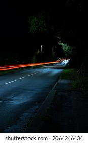 Long Exposure Of Cars On Country Uk Road At Night 