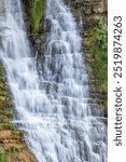 Long exposure of cascading Tortum Waterfall, symbolizing the persistence and flow of natural forces