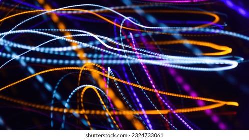 Long exposure colorful light painting photography, abstract background, curvy lines of vibrant neon metallic against a black background
					