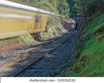 Long Exposure Daytime Light Trails Of A Train Going Through Tunnel Hill On The Yarra Valley Railway. Yarra Valley,  Melbourne,  Australia. 