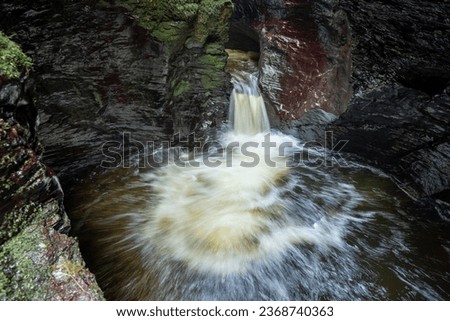 Long exposure of the Devils Cauldron waterfall on the river Lyd at Lyford Gorge in Devon