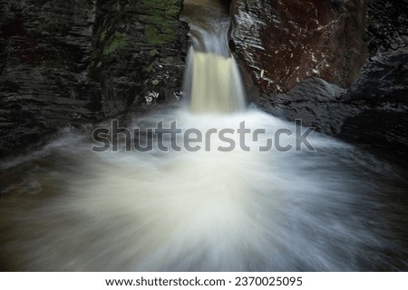 Long exposure of the Devils Cauldron waterfall on the river Lyd at Lyford Gorge in Devon