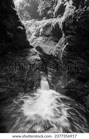 Long exposure of the Devils Cauldron waterfall on the river Lyd at Lyford Gorge in Devon
