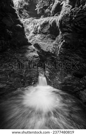 Long exposure of the Devils Cauldron waterfall on the river Lyd at Lyford Gorge in Devon