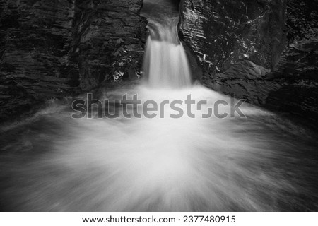 Long exposure of the Devils Cauldron waterfall on the river Lyd at Lyford Gorge in Devon