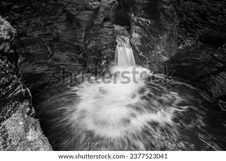 Long exposure of the Devils Cauldron waterfall on the river Lyd at Lyford Gorge in Devon