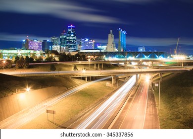 A long exposure of an elevated view of Kansas City, Missouri skyline at night.