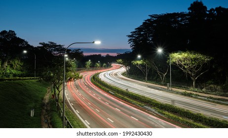 Long exposure of evening peak hour traffic along pan island expressway in Singapore