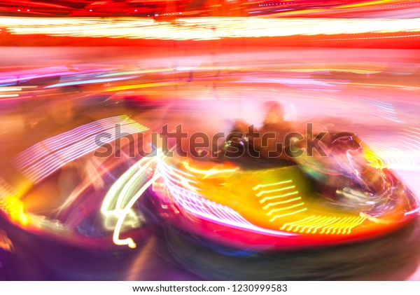 Long exposure\
fairground ride lights\
