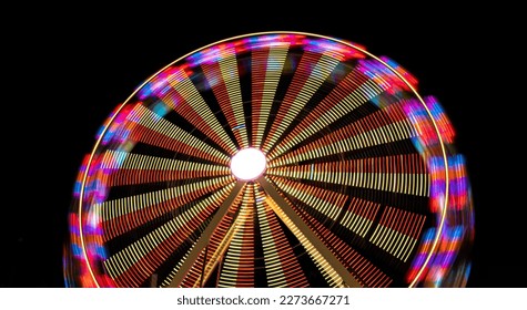 Long exposure of ferris wheel, soft focus - Powered by Shutterstock