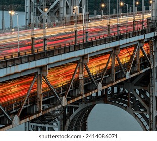 Long exposure of the George Washington Bridge at night showing blurred lines of heavy car traffic  - Powered by Shutterstock