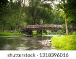 long exposure image of covered bridge park in Cedarburg Wisconsin during summer