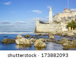 Long exposure image of the fortress of El Morro in the bay of Havana with rocks and silky water