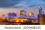 Long exposure of Jacksonville, Florida skyline and Acosta bridge spanning St. Johns river, at dusk. Jacksonville is a city located on the Atlantic coast of northeastern Florida.