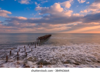 Long Exposure Landscape With Old Broken Bridge In The Sea