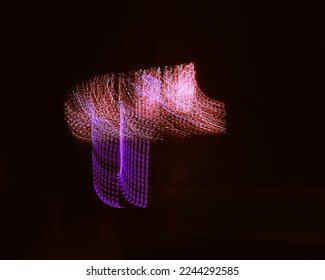 Long exposure light painting photography, curvy lines of vibrant neon different color against a black background.Bright neon line designed background.Modern background in lines style.Abstract,creative - Shutterstock ID 2244292585