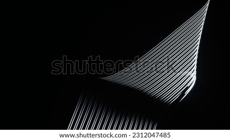 Long exposure light painting photography, curvy lines of vibrant neon metallic white against a black background

