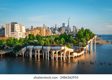 Long exposure of Little Island over the Hudson River in Chelsea, New York, with the lower Manhattan skyline as a stunning backdrop at dusk. - Powered by Shutterstock