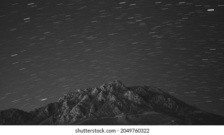 Long Exposure Of Mountain And Stars Showing Earth's Rotation Around Itself