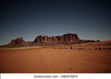 Long Exposure Night Photography Of Bedouin Tent Camp In Wadi Rum Desert In Jordan