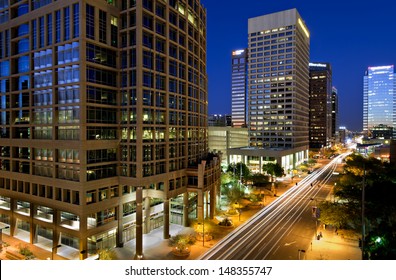 Long exposure photo of the a city street in downtown Phoenix, Arizona at night.