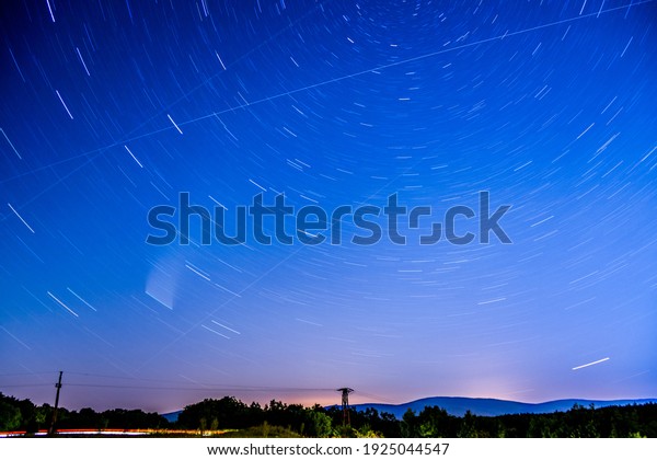 Long exposure photo with the\
ISS shooting stars and a comet, Neowise, falling star, starry night\
