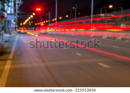 Long exposure photo of light trails on the street in Thailand.
