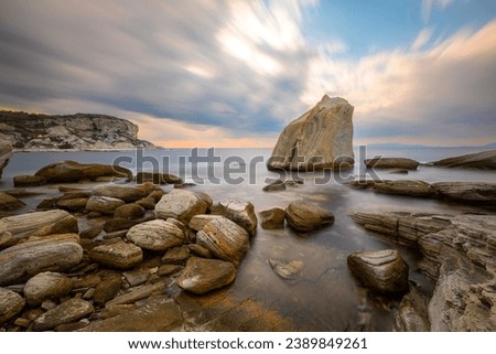 Similar – Image, Stock Photo Rocky cliff with sunset on the horizon