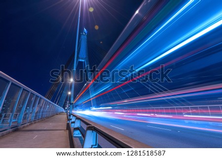 Long exposure picture of a night traffic through the Anzac Bridge in Sydney