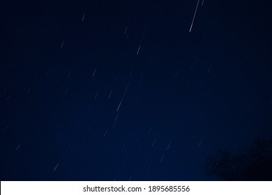 long exposure picture of stars moving in circular motion. looking like meteor shower.