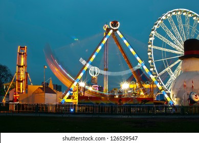 Long Exposure Pictures Of Amusement Park Rides And Wheels At Night