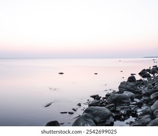 Long exposure, pink sunset, calm sea at Baltic sea - Powered by Shutterstock